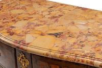 A Régence Gilt Bronze Mounted Tulipwood and Parquetry Marble-Top Commode