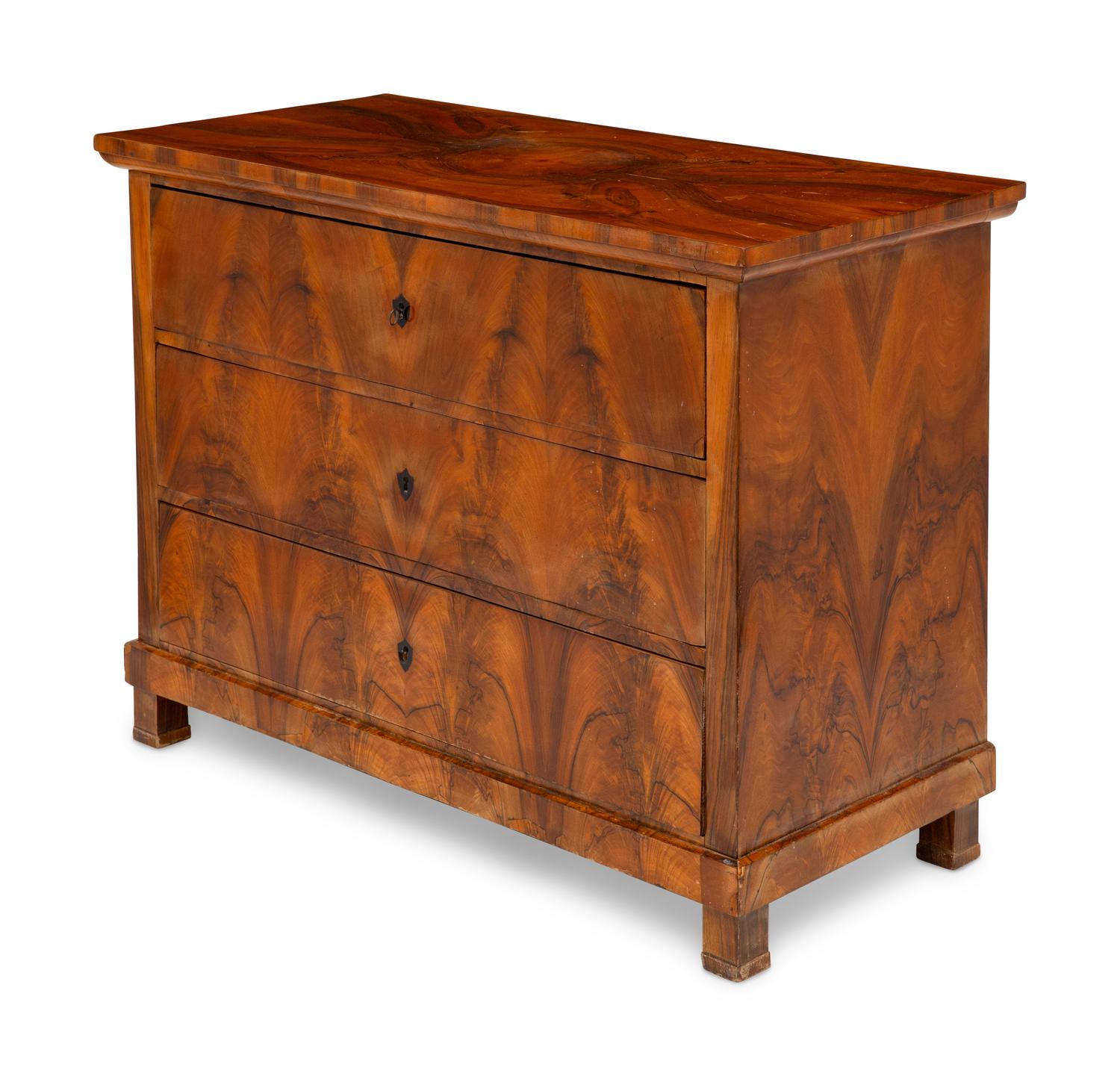 A Biedermeier Figured Walnut Commode