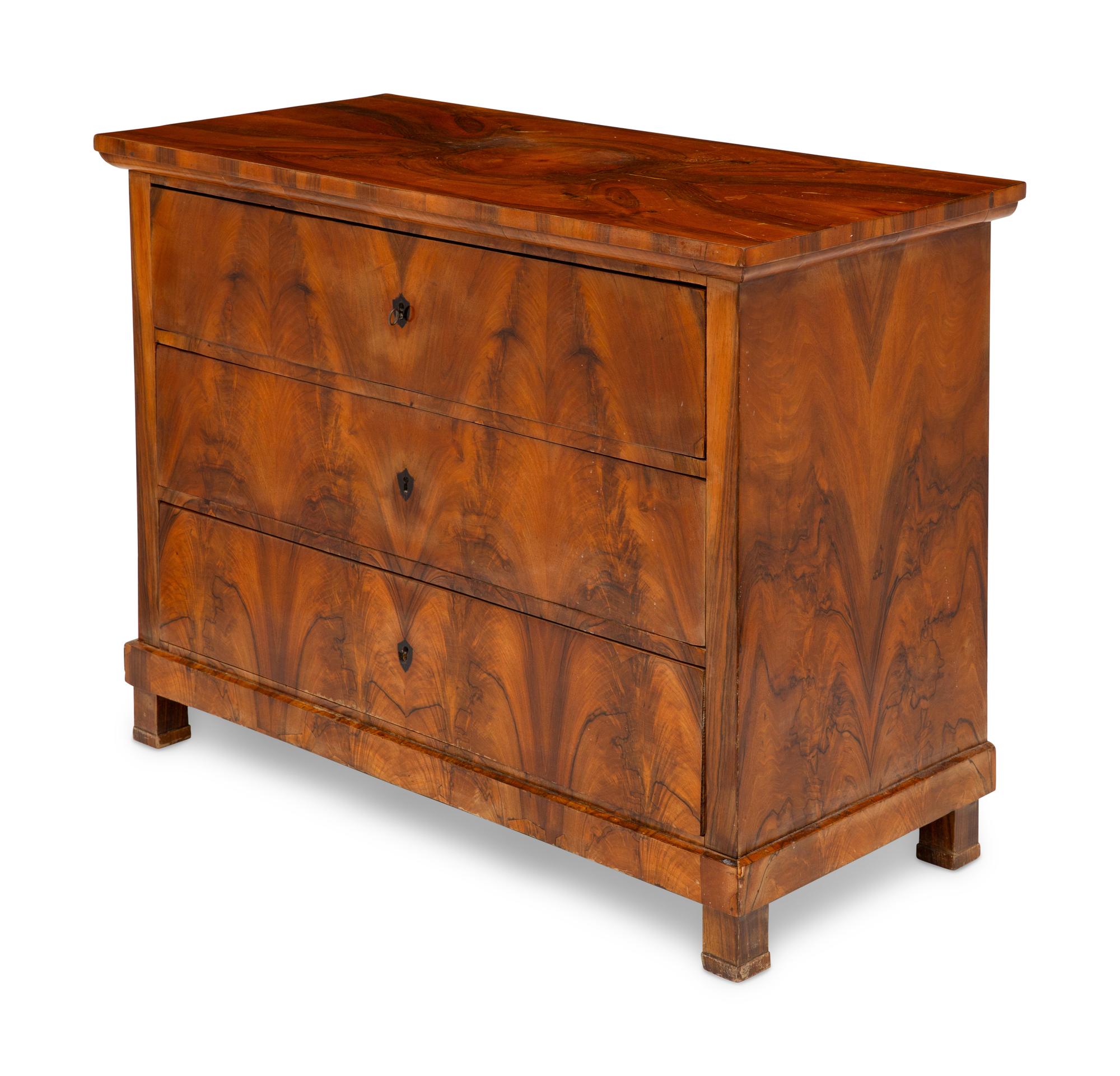A Biedermeier Figured Walnut Commode
