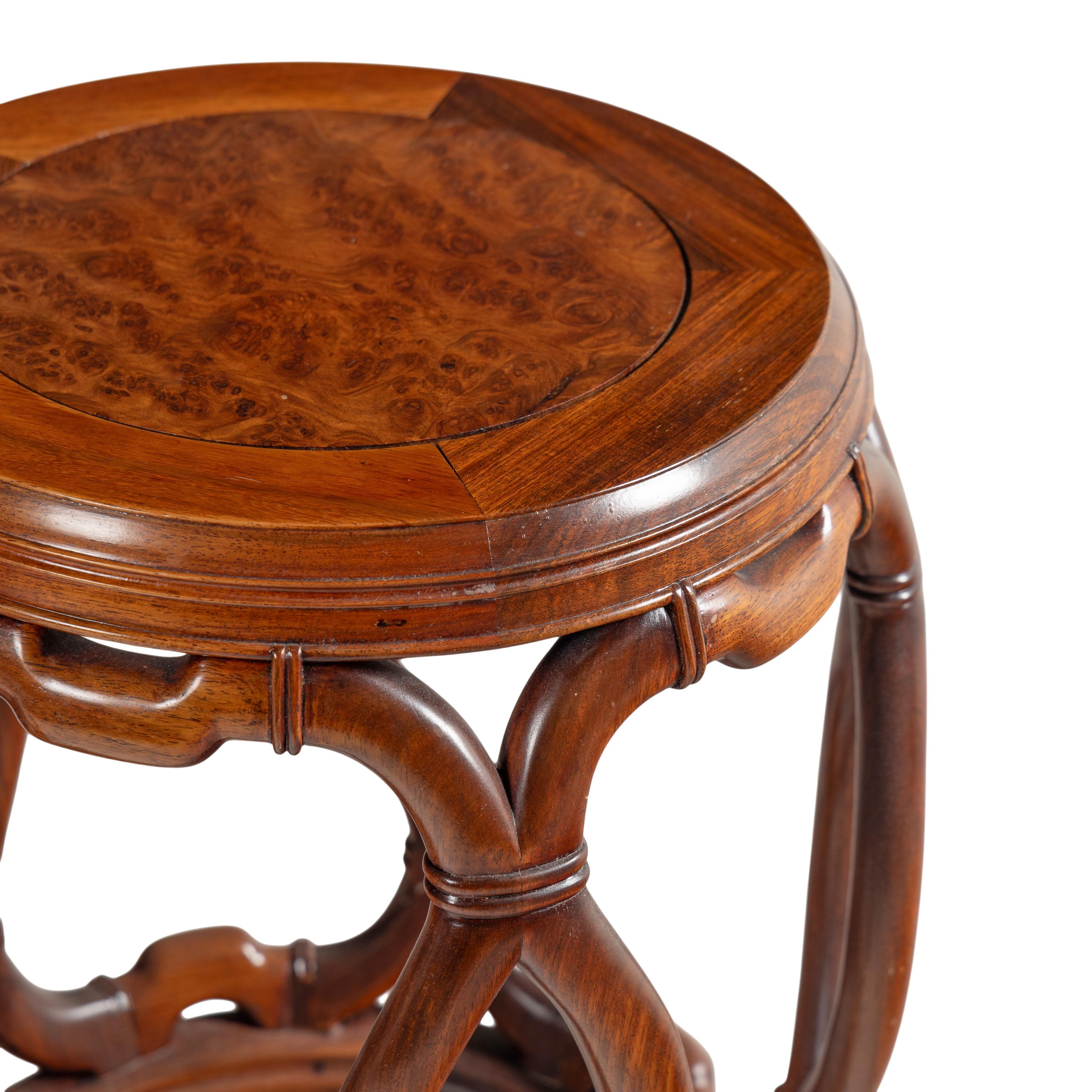 A Pair of Chinese Burlwood Top Hardwood Garden Stools and a Famille Rose Porcelain Garden Stool, Gudeng, 20th Century 近代 鼓凳一組三件