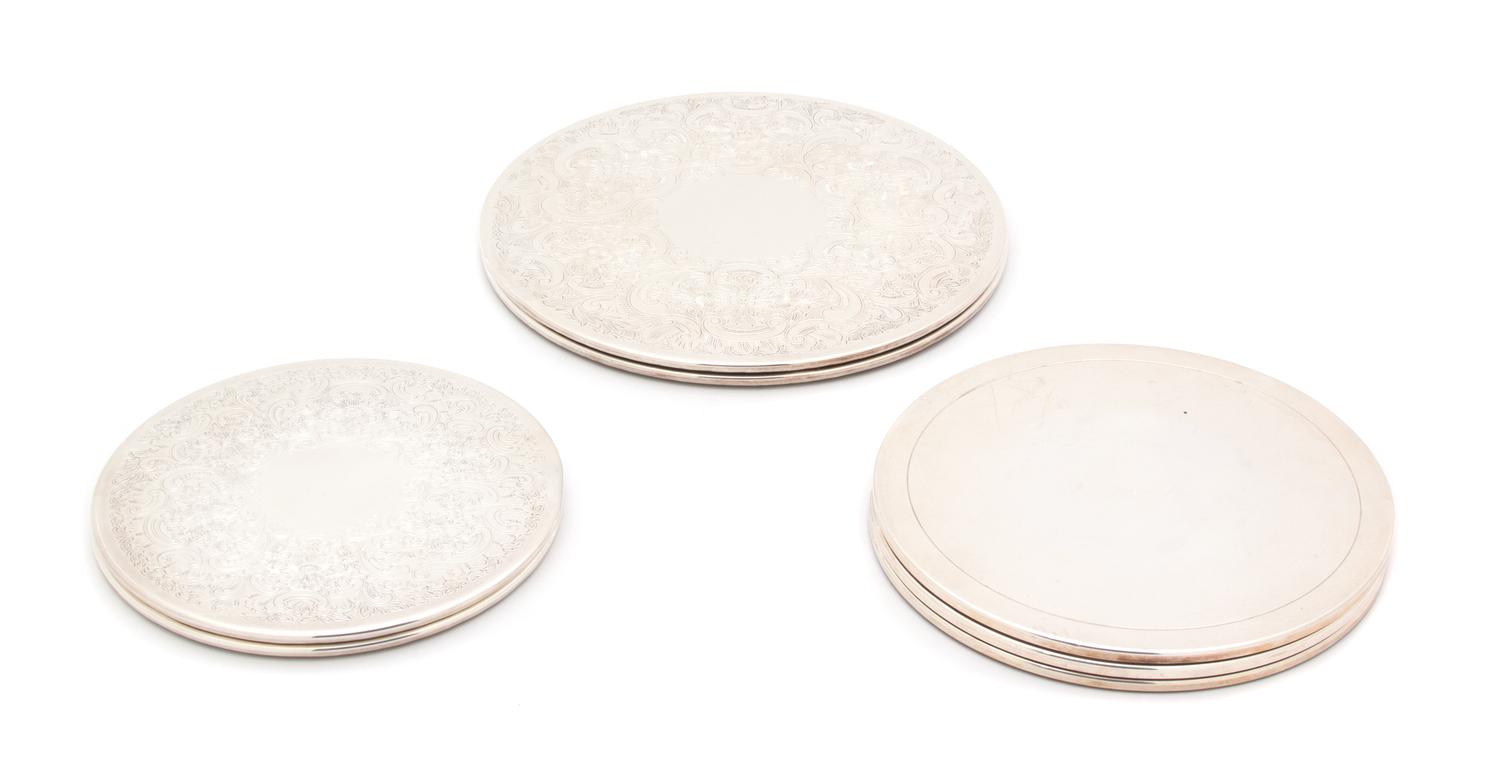 A Group of Seven Silver Plate Hot Plate/Trivets Largest diameter 9 1/8 inches. — 20TH CENTURY