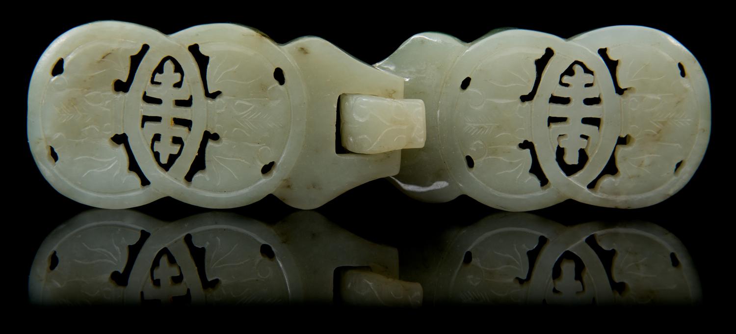 A Carved Jade Belt Buckle Length 5 1/8 inches.