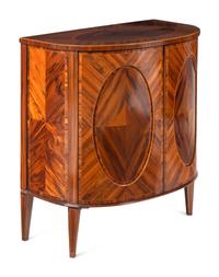 A Pair of George III Goncalo Alves Demilune Cabinets