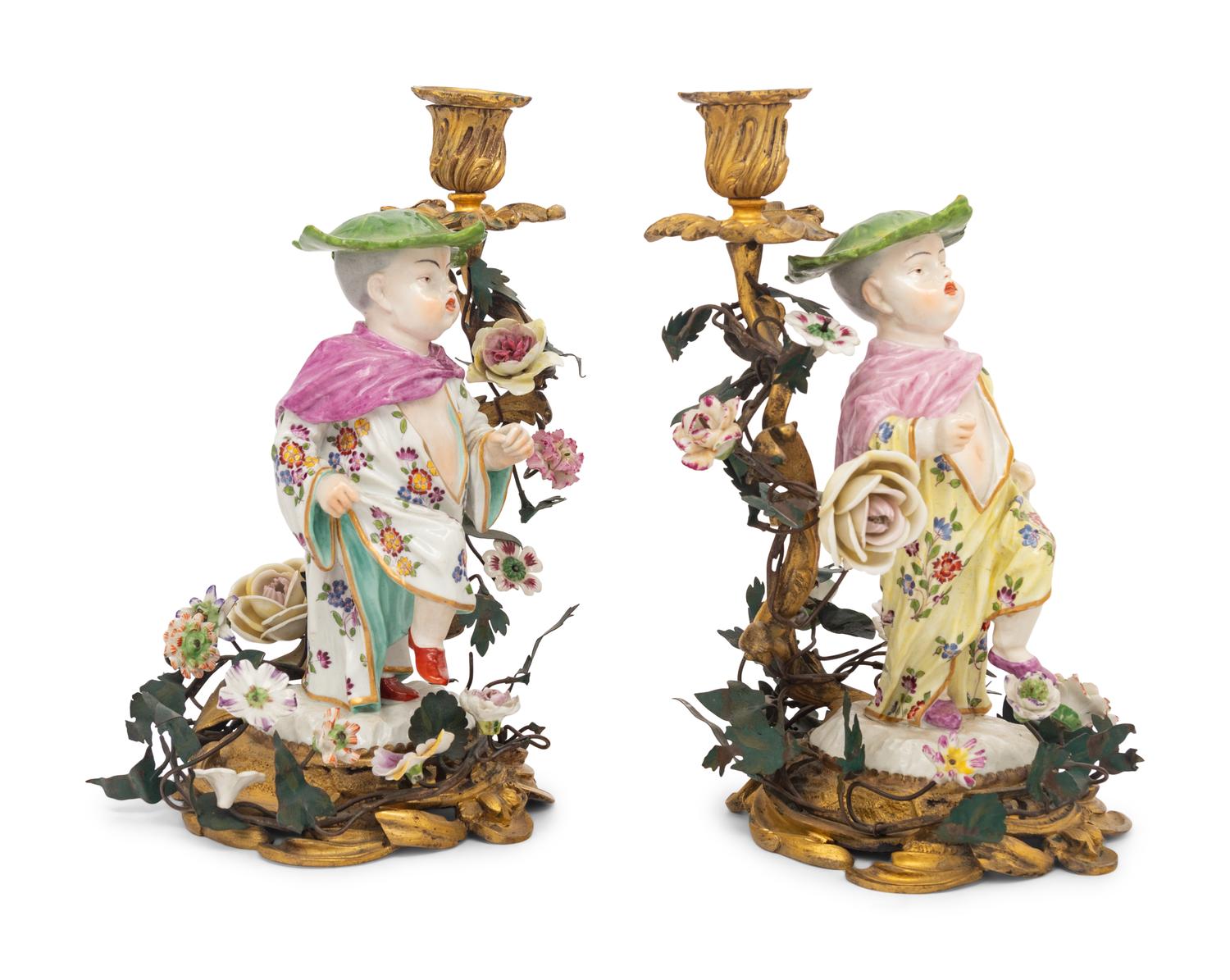 A Pair of French Porcelain, Tôle, and Gilt Bronze Figural Candlesticks