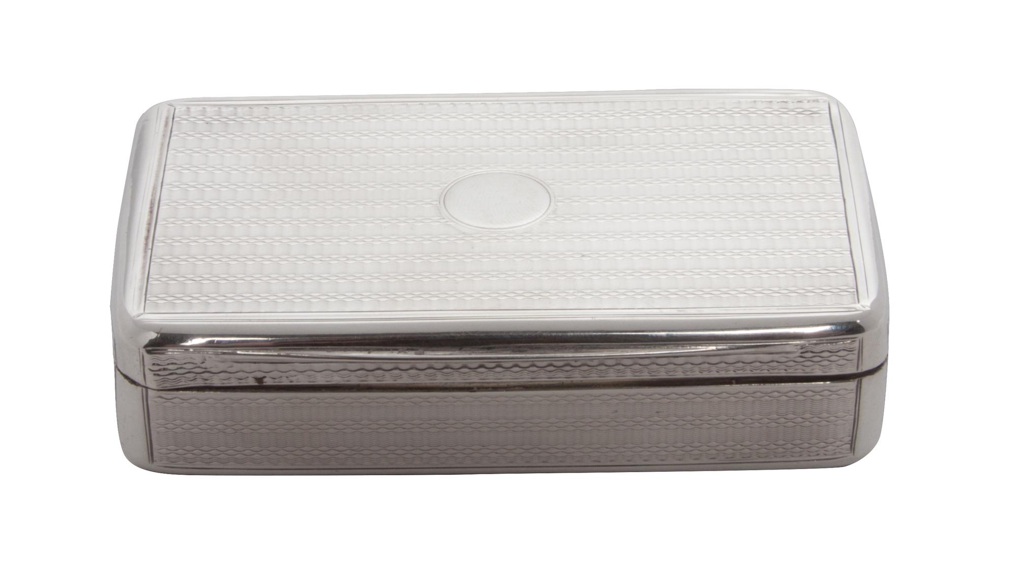 A Regency Silver Snuff Box, Maker's Mark WE in a Rectangle, London, 1819, of rectangular form with rounded corners and an engine-turned