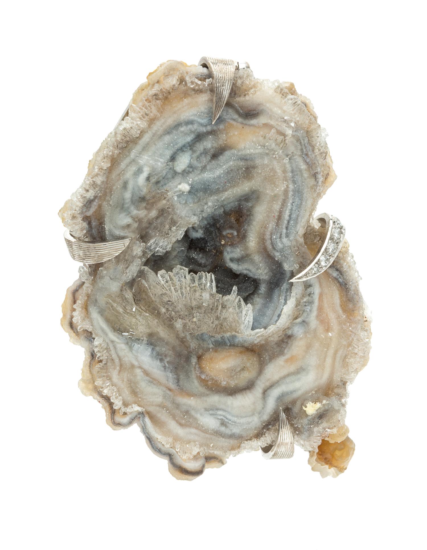 An 18 Karat White Gold, Agate Geode and Diamond Pendant/Brooch, Andrew Grima, Circa 1975, 26.80 dwts.