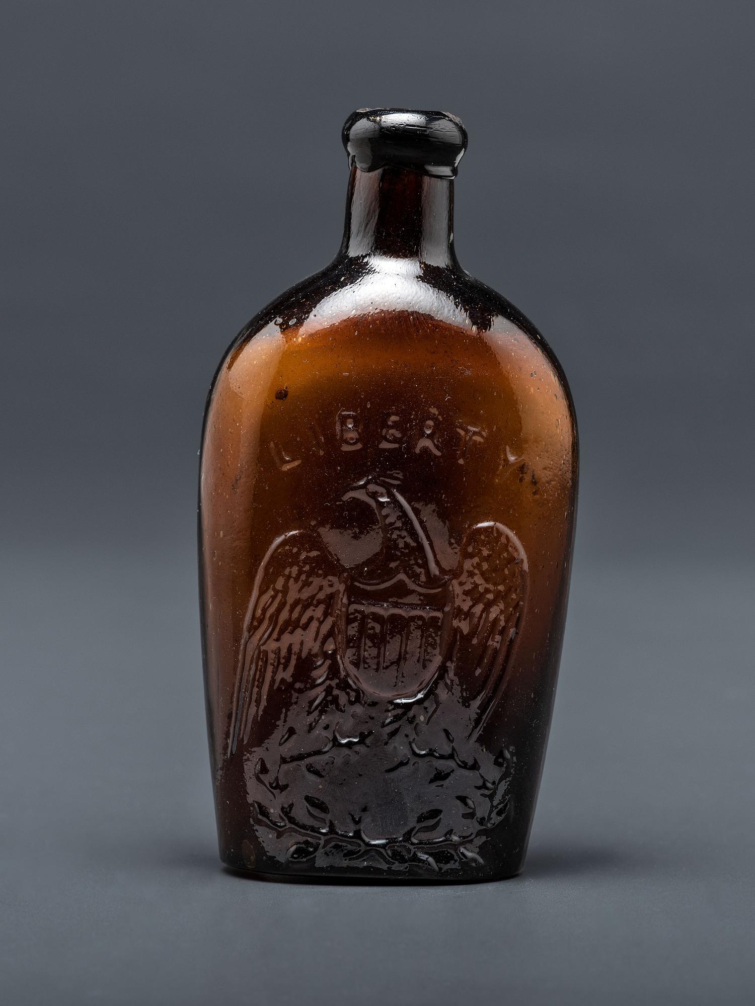 A Molded-Glass Flask in Amber by Willington Glass Company, Connecticut
