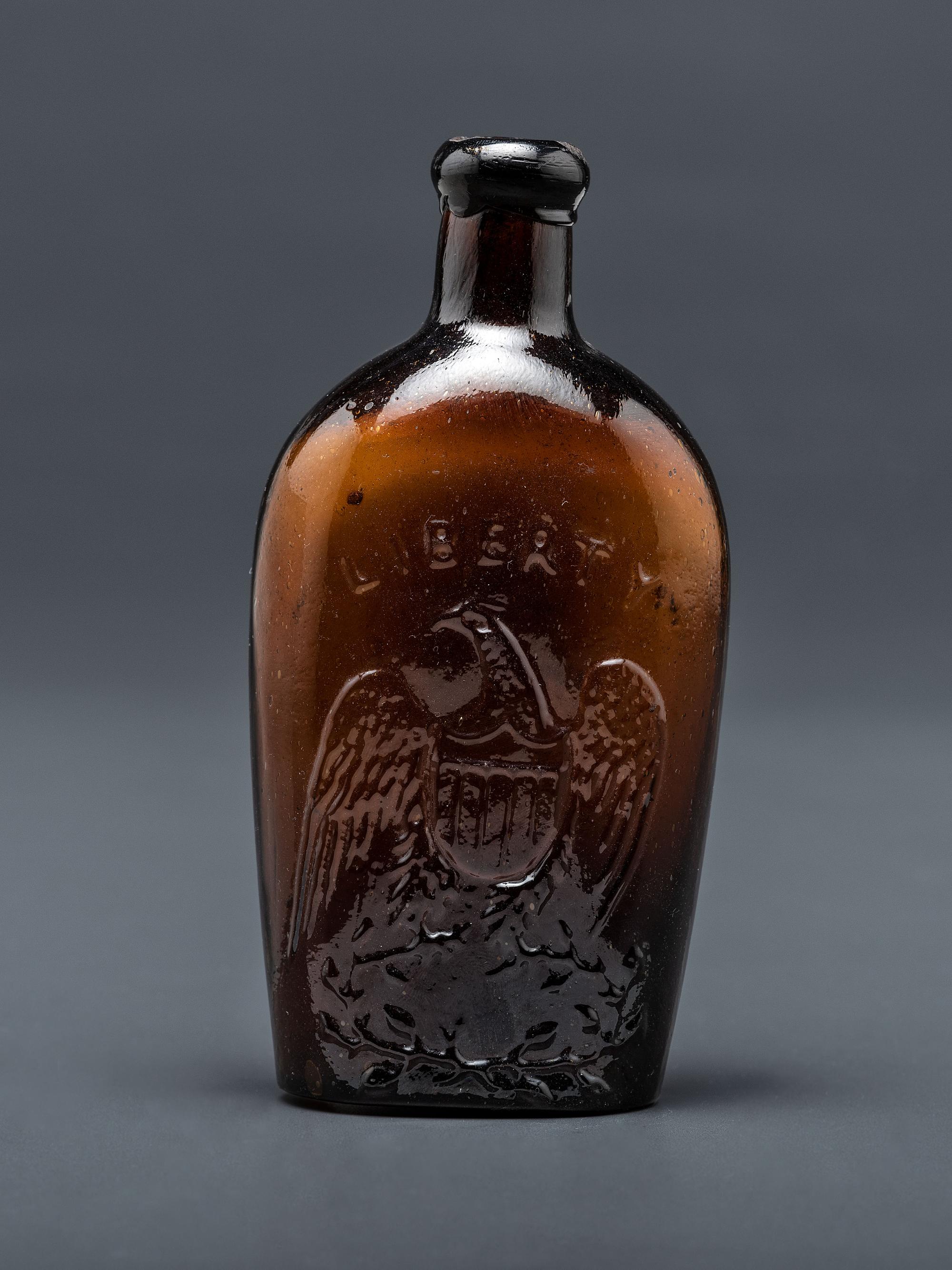 A Molded-Glass Flask in Amber by Willington Glass Company, Connecticut
