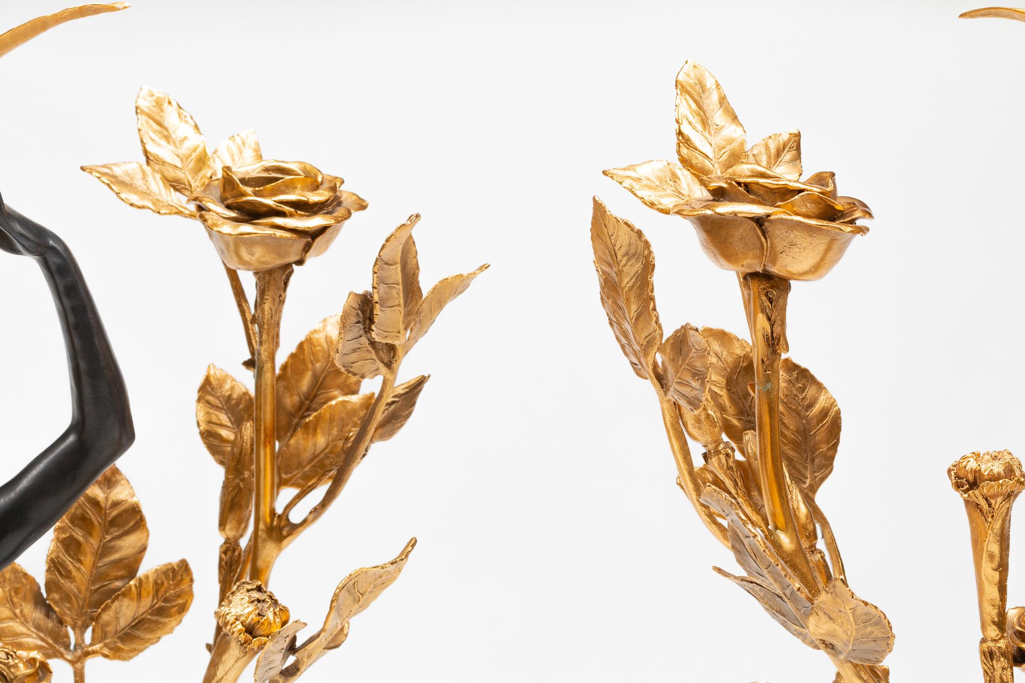 A Pair of French Gilt and Patinated Bronze and Marble Figural Three-Light Candelabra