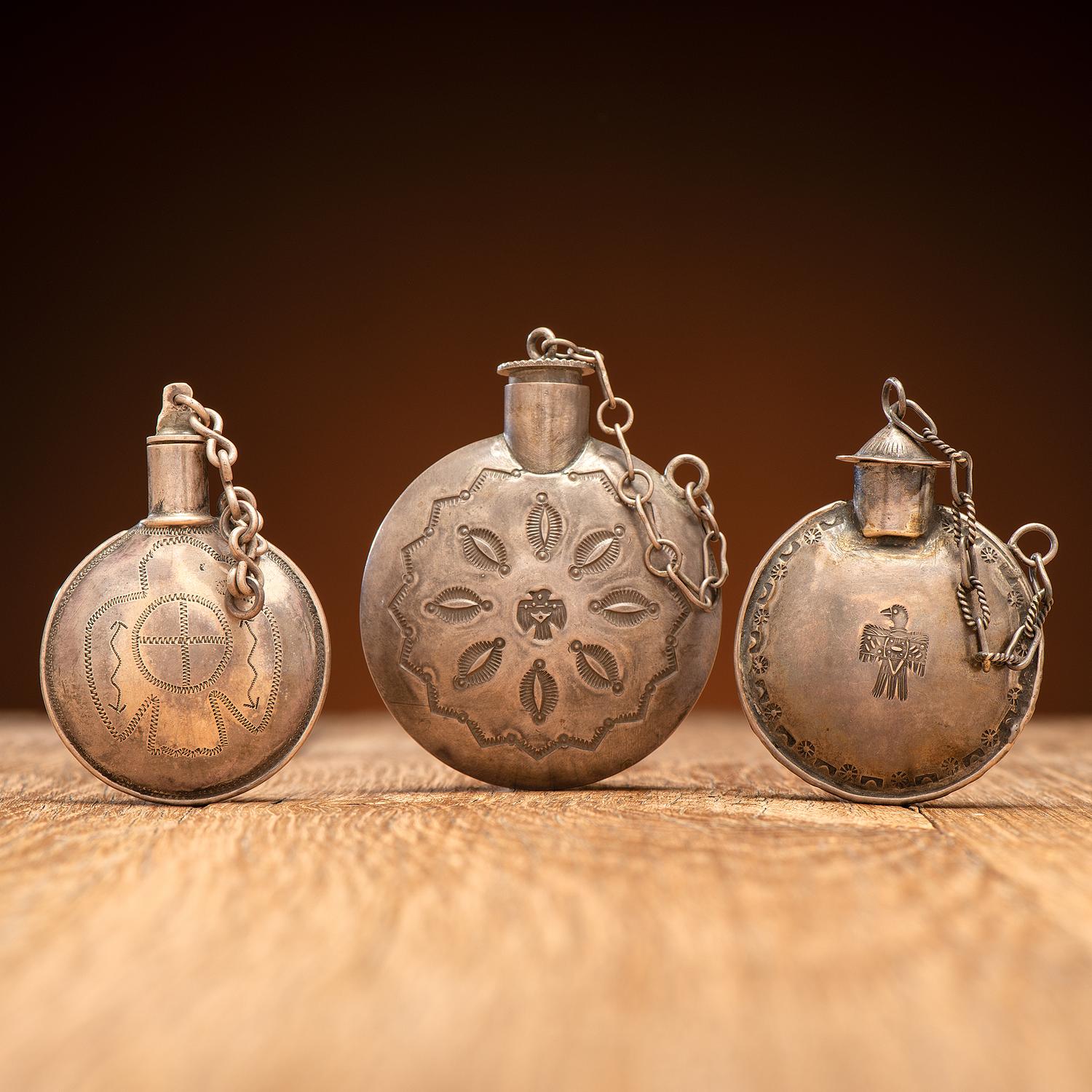 Navajo Stamped Silver Tobacco Canteens, with Thunderbird Designs