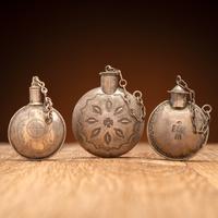 Navajo Stamped Silver Tobacco Canteens, with Thunderbird Designs