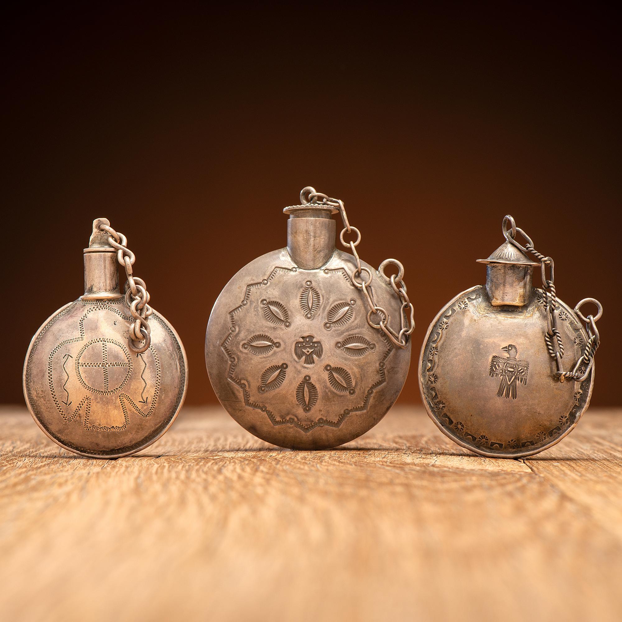 Navajo Stamped Silver Tobacco Canteens, with Thunderbird Designs