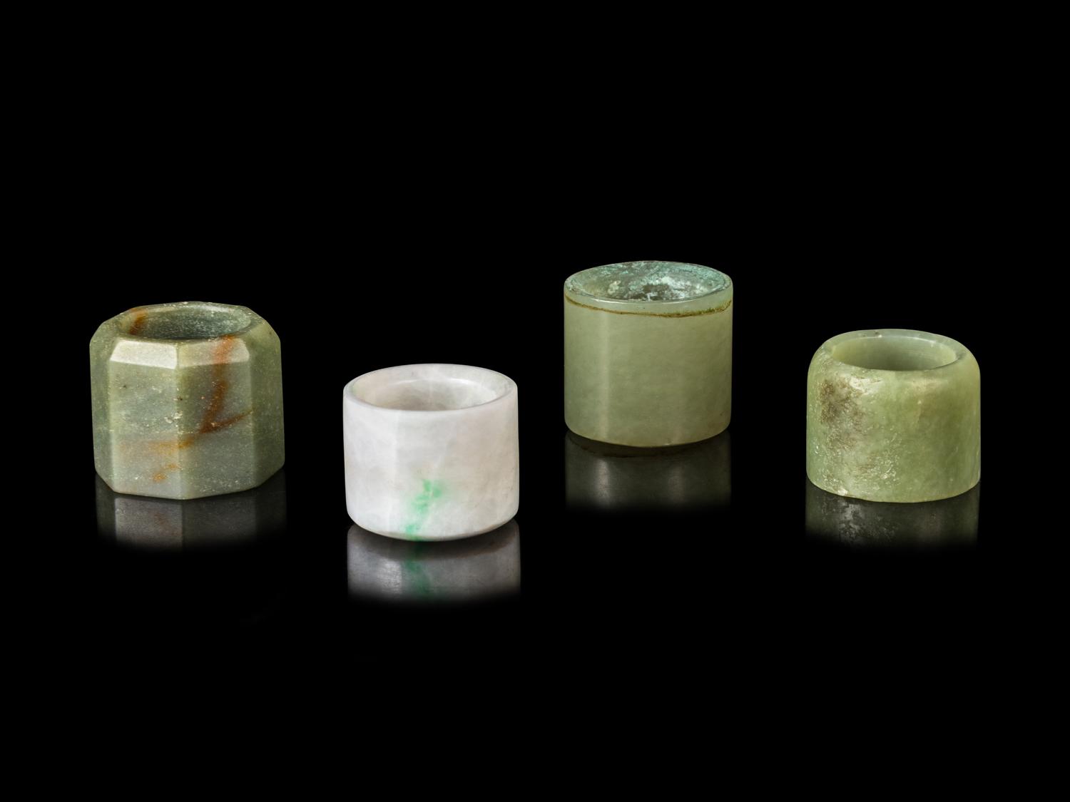 Four Chinese Jade and Jadiete Archer's Rings