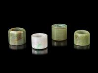 Four Chinese Jade and Jadiete Archer's Rings