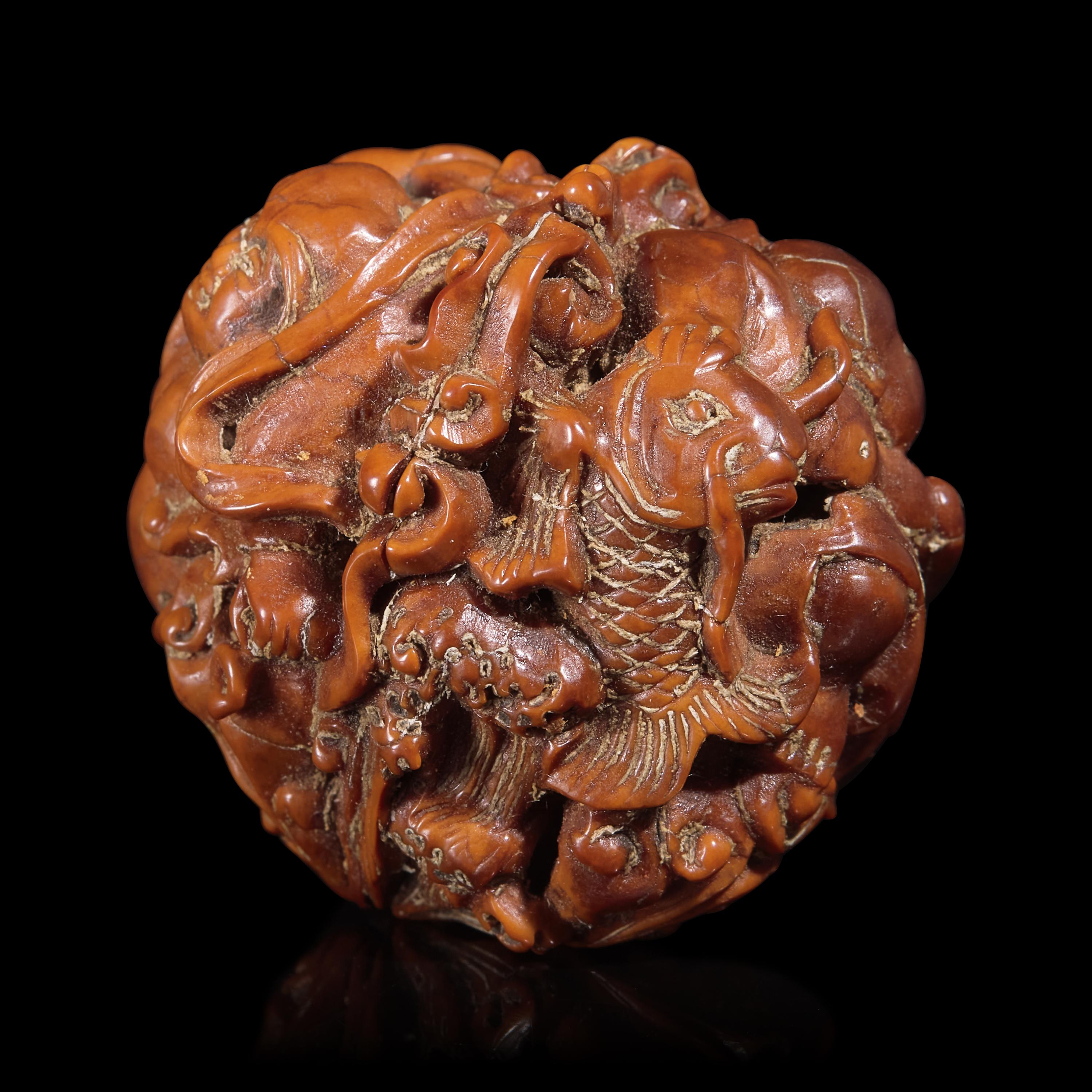 A Chinese Carved Luohan Walnut, 19th/Early 20th Century — 晚清/民國 羅漢圖文玩核桃