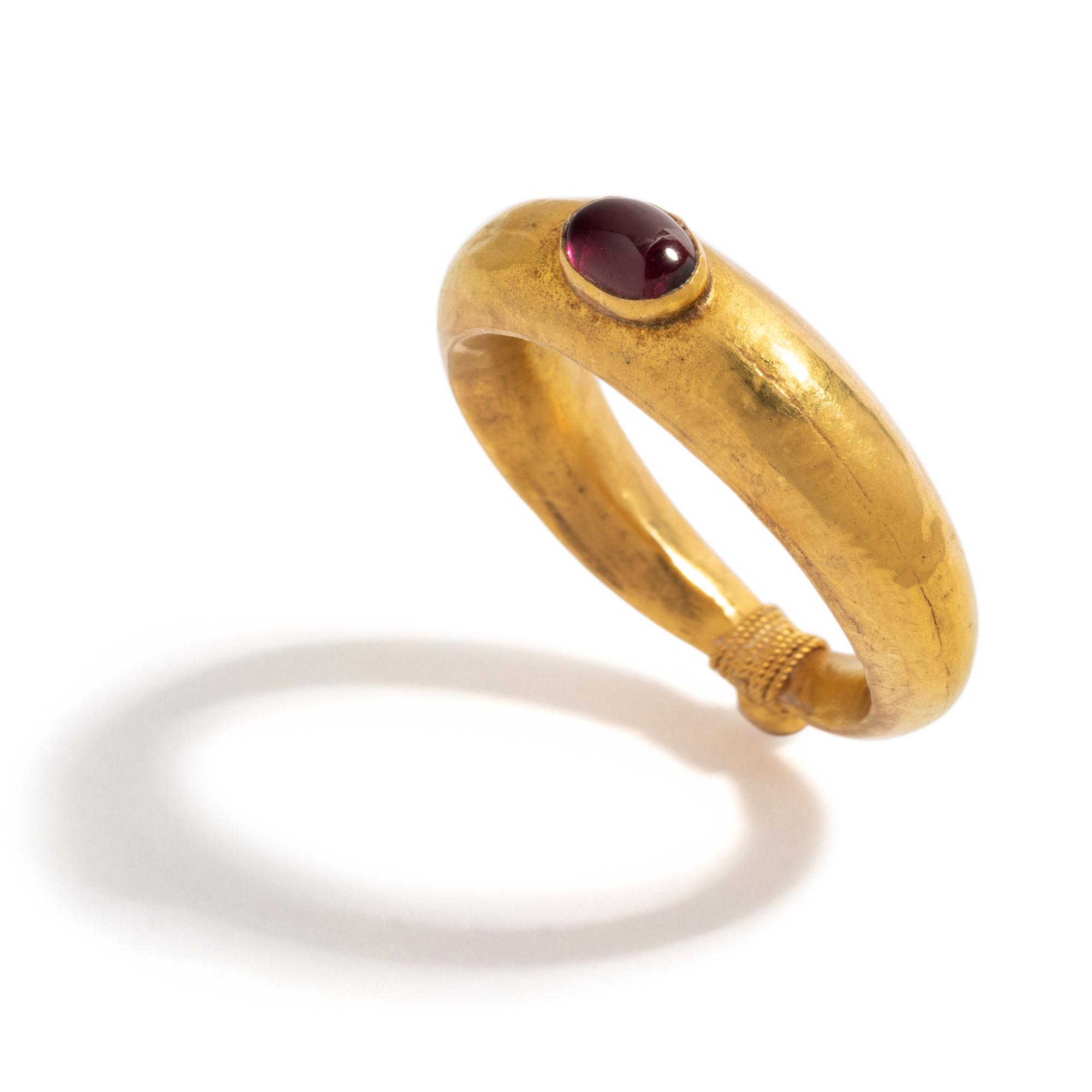 A Roman Gold and Garnet Cabochon Finger Ring