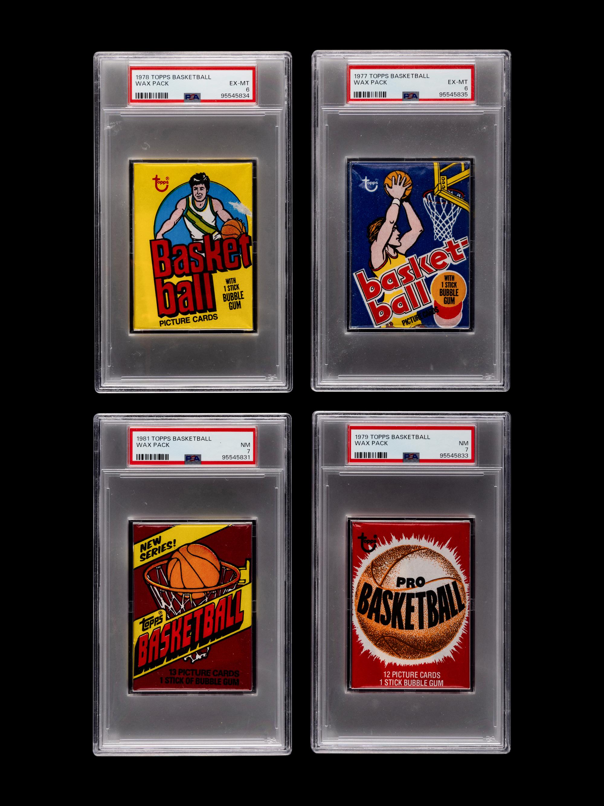 A Group of 4 Sealed Unopened 1970s and 1980s PSA Graded Topps Basketball Wax Packs
