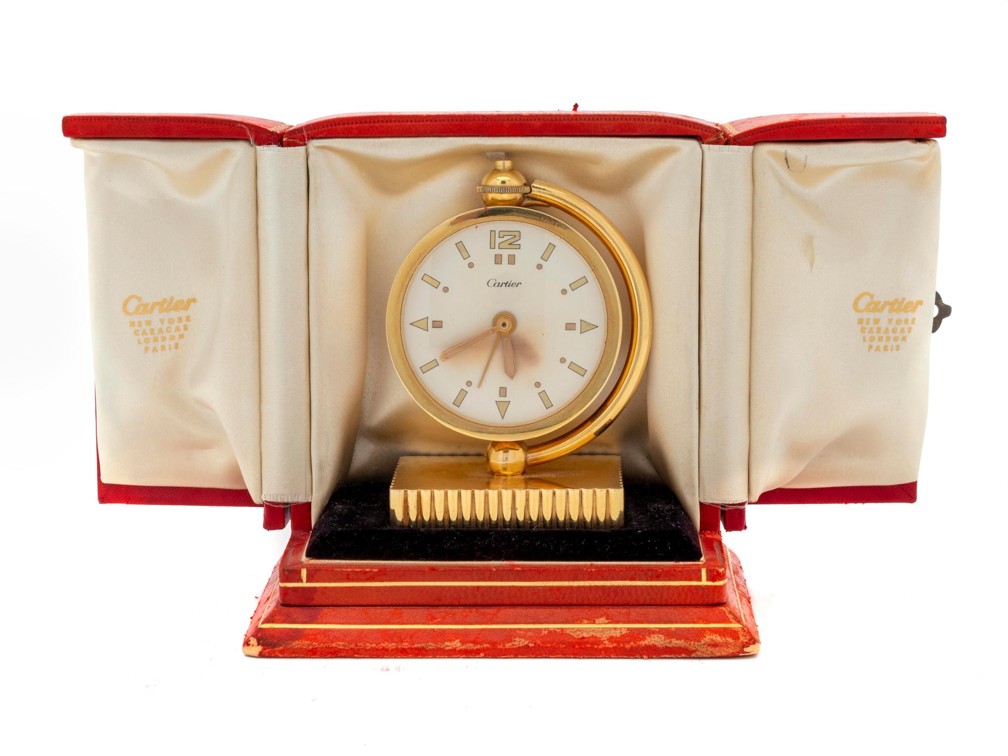 A Cartier Art Deco 18K Traveling Desk Clock — CIRCA 1940's