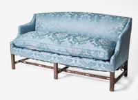 A George III box-form mahogany sofa with blue silk damask upholstery, second half 18th century