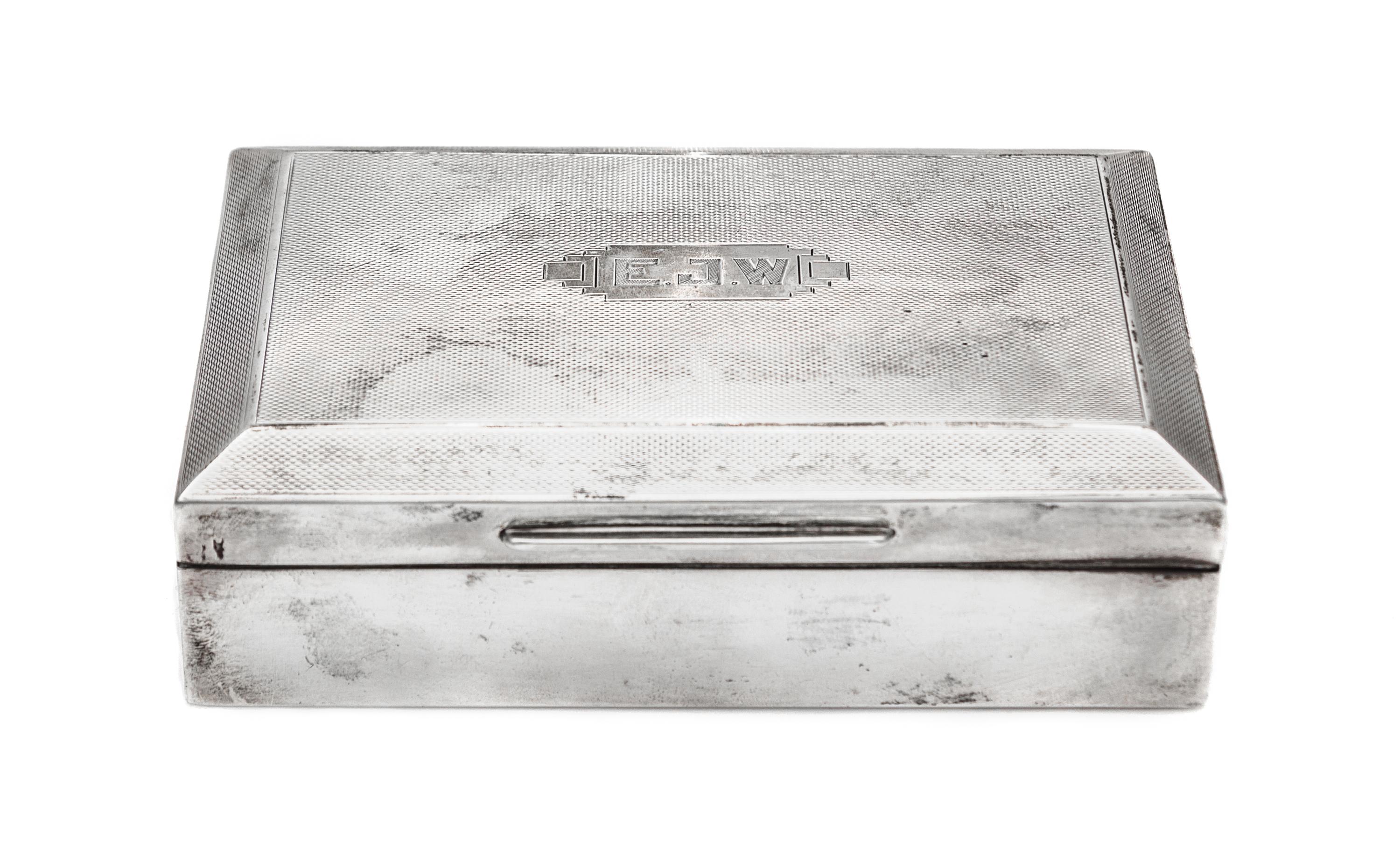 A George VI Silver Cigarette Box, Ernest W. Haywood, Birmingham, 1939, of rectangular form with a wood liner.