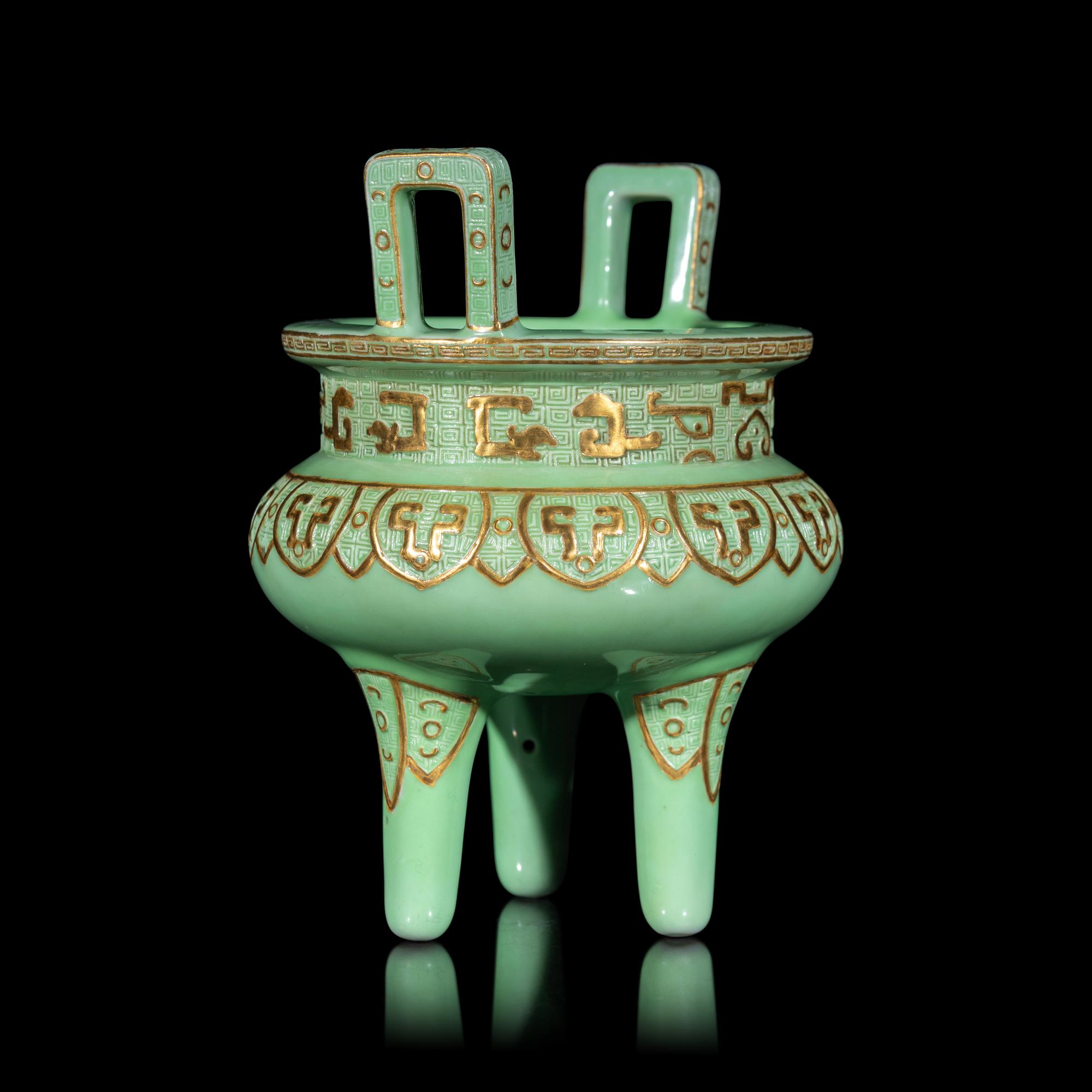 A Chinese Gilt Highlighted Green Glazed Porcelain Ding -Form Censer, Qing Dynasty 清 綠地金彩凸雕仿古鼎式爐