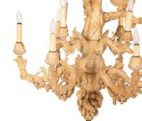 A Carved Fruitwood Ten Light Chandelier