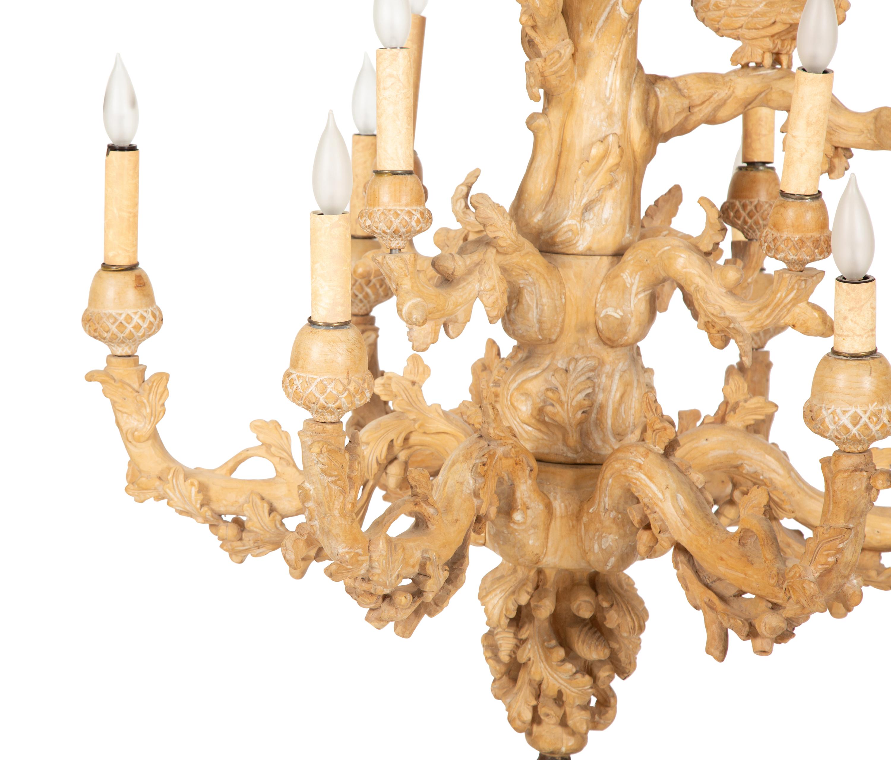 A Carved Fruitwood Ten Light Chandelier