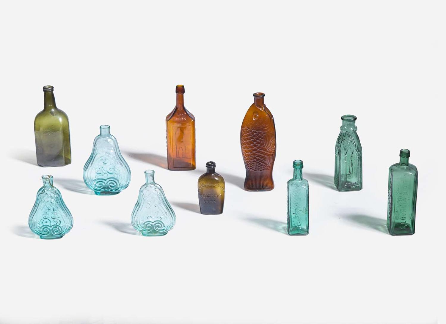 A collection of ten mold-blown colored glass bottles, various makers, 19th century