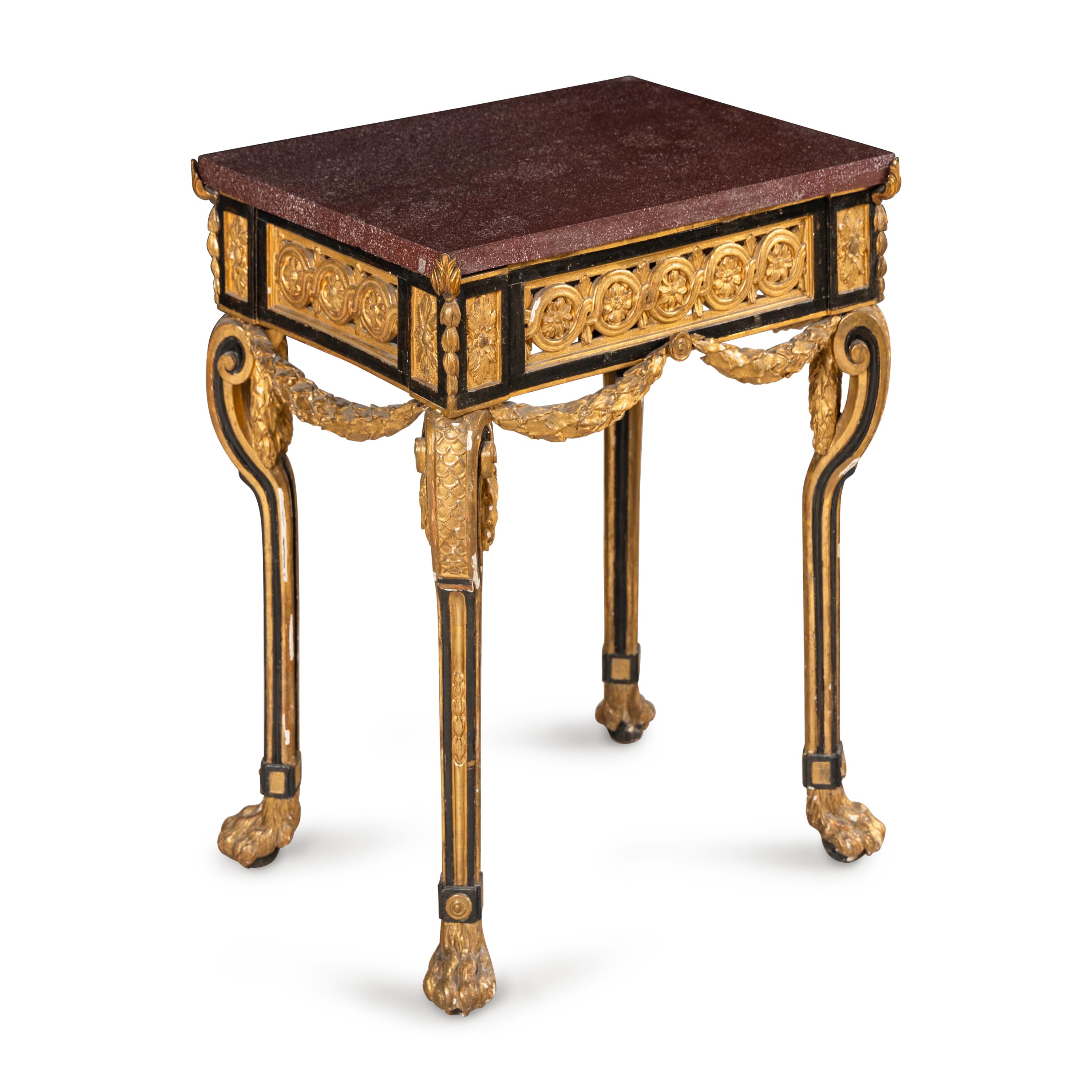 A Neoclassical Style Gilt Bronze Mounted Parcel-Gilt, Ebonized and Porphyry-Top Center Table