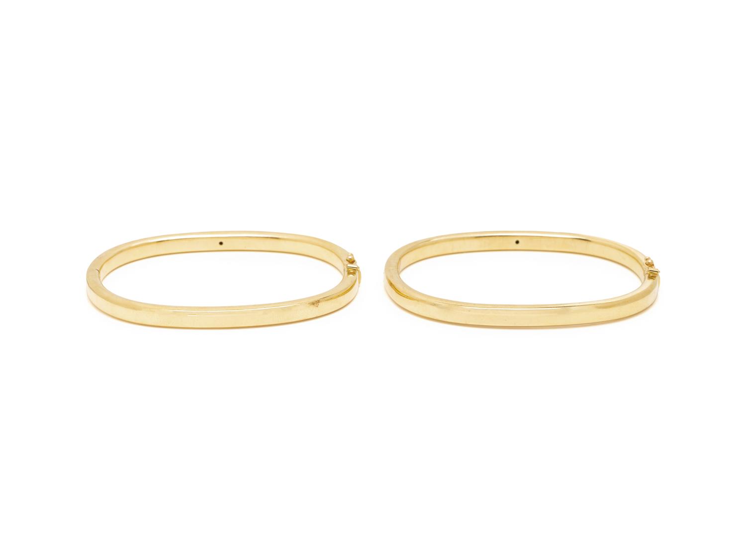 PAIR OF YELLOW GOLD AND GEMSTONE BANGLE BRACELETS