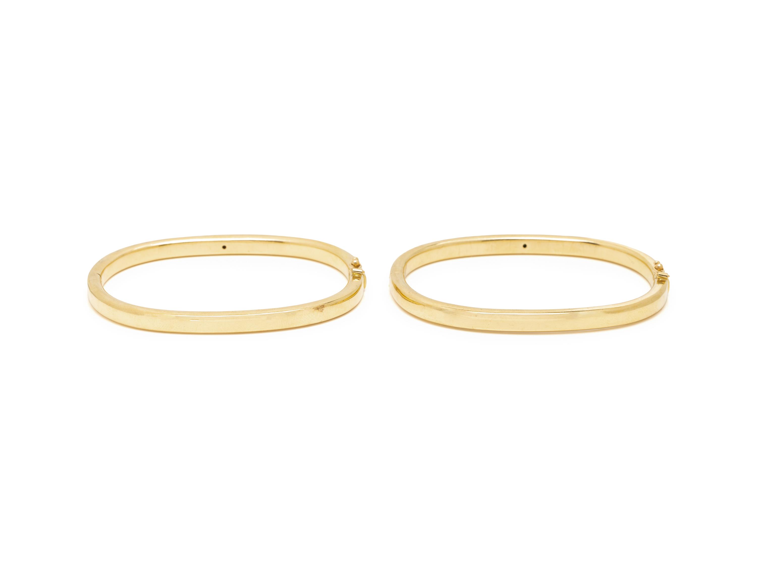 PAIR OF YELLOW GOLD AND GEMSTONE BANGLE BRACELETS