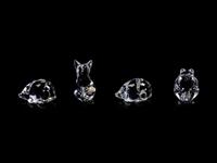 A Collection of Twelve Steuben Hand Coolers and Small Animals