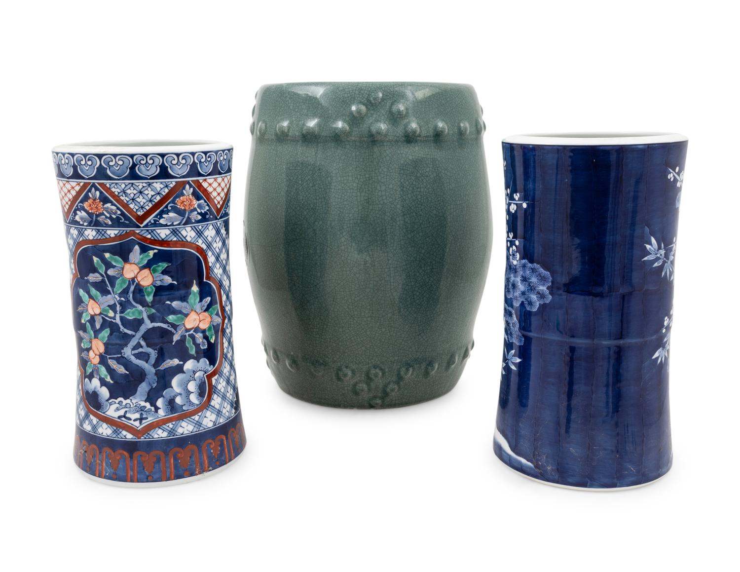 Two Japanese Porcelain Umbrella Stands and A Chinese Celadon Porcelain Barrel-Form Garden Stool