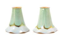 Steuben, EARLY 20TH CENTURY, a pair of Aurene glass shades, with pulled feather decoration, together with a brass two-light fixture
