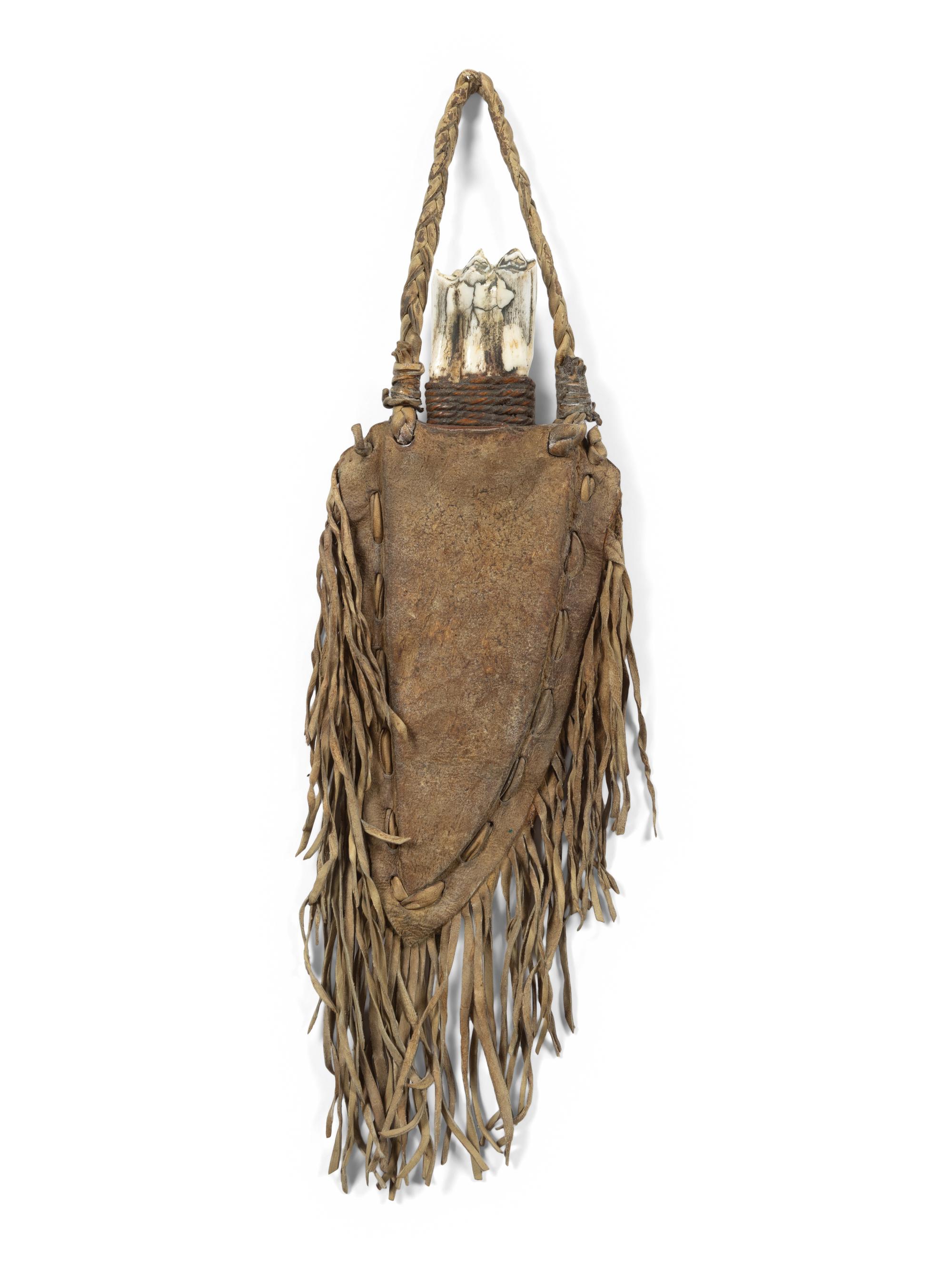 A Fringed Leather or Hide Bag with Attached Arrowheads