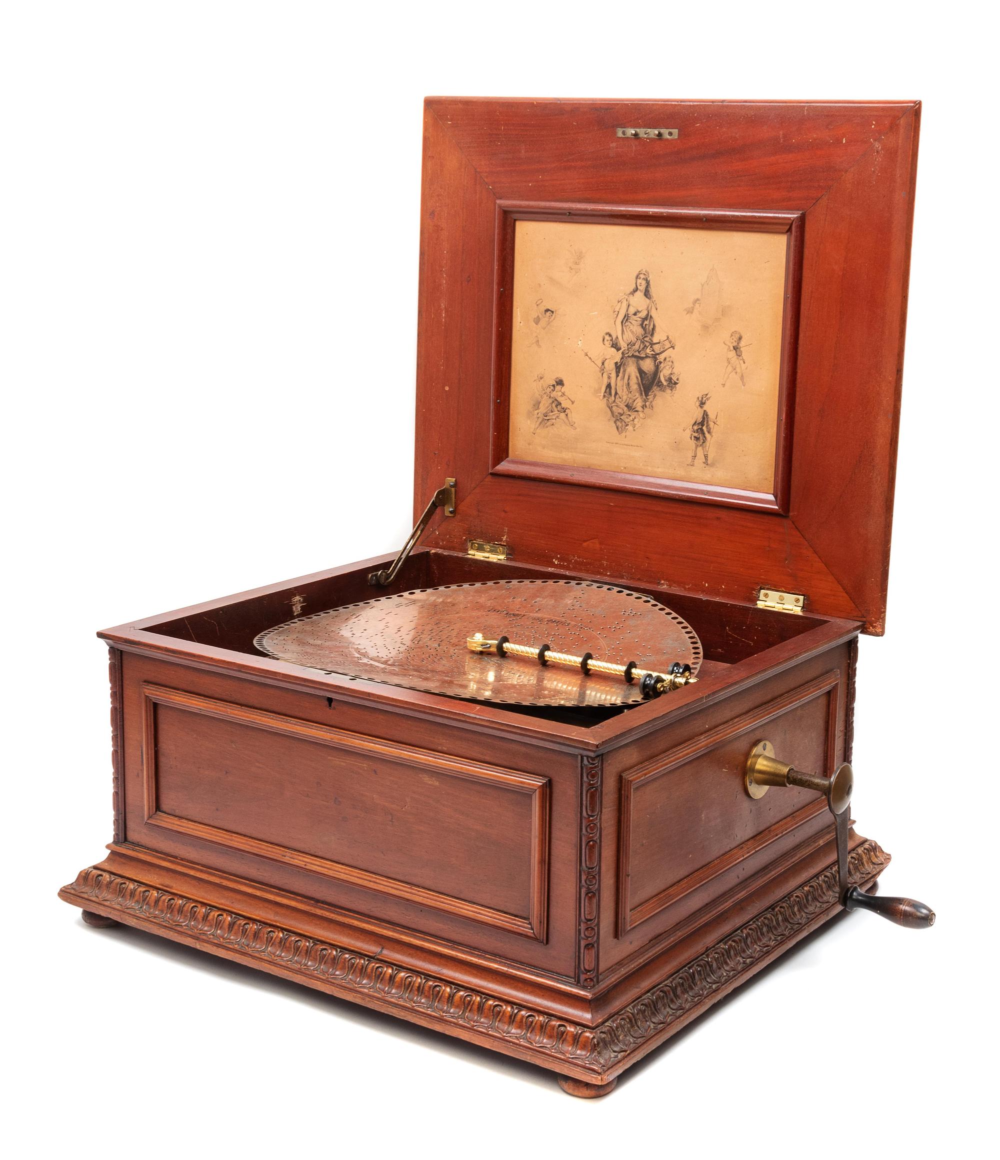 A Regina 15 1/2-Inch Double-Comb Disk Oak Music Box