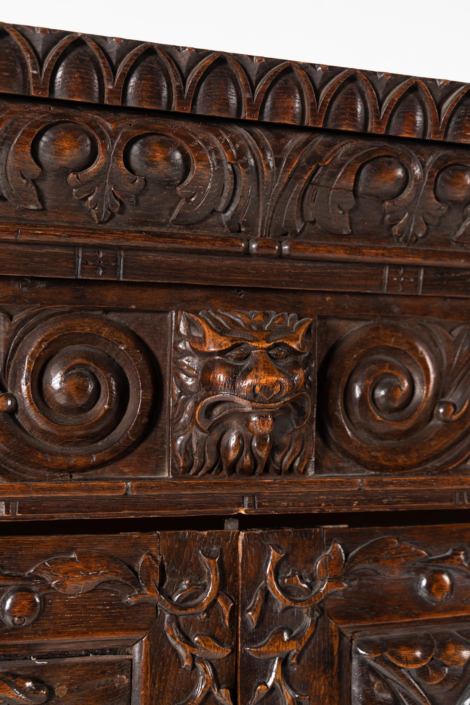 A Continental Carved Oak Wardrobe Cabinet