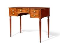 A George III inlaid mahogany, satinwood, and kingwood writing table, circa 1810