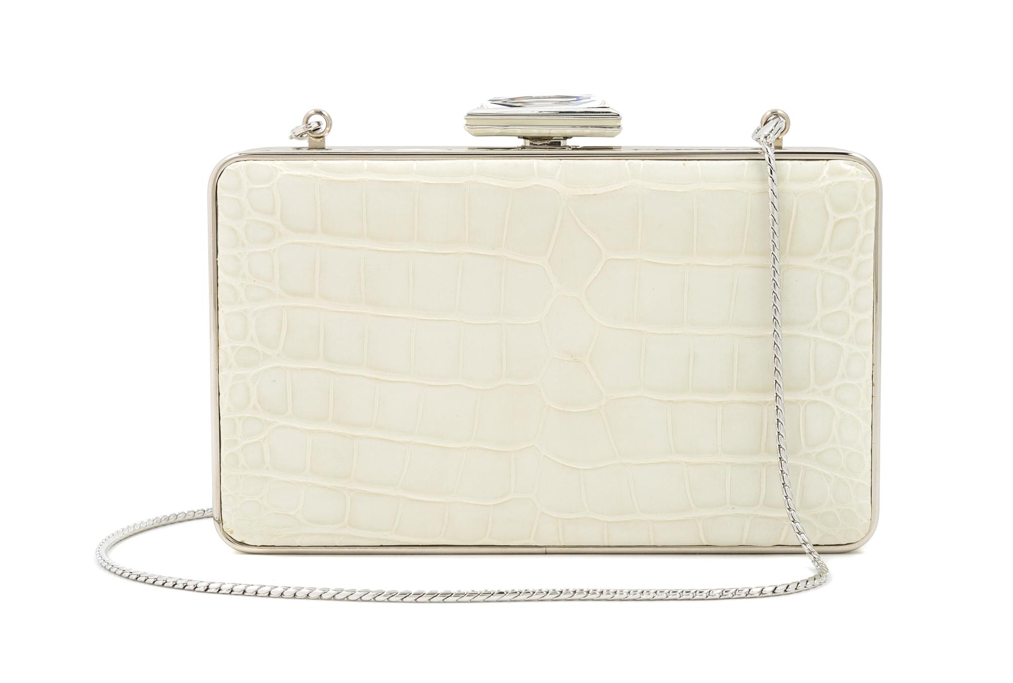 A Judith Leiber Cream Crocodile Clutch, 6" x 3.5" x 1.5".