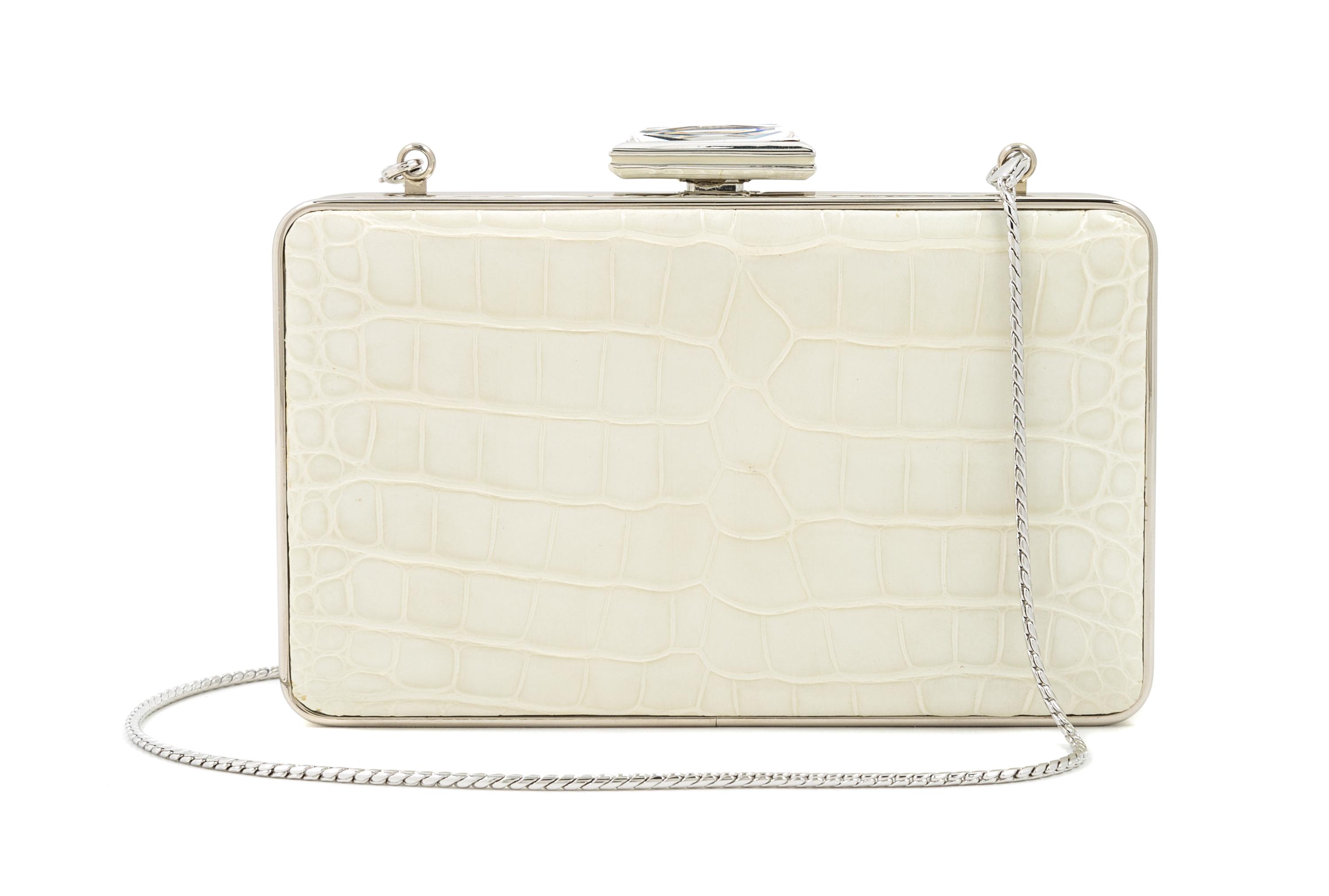 A Judith Leiber Cream Crocodile Clutch, 6" x 3.5" x 1.5".