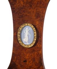 A French Gilt Bronze and Jasperware Mounted Burlwood Dining Suite