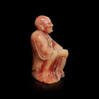 A finely-carved Chinese beige and rose soapstone figure of a seated lohan 壽山石雕羅漢 Qing dynasty, 18th/19th century ? ???????