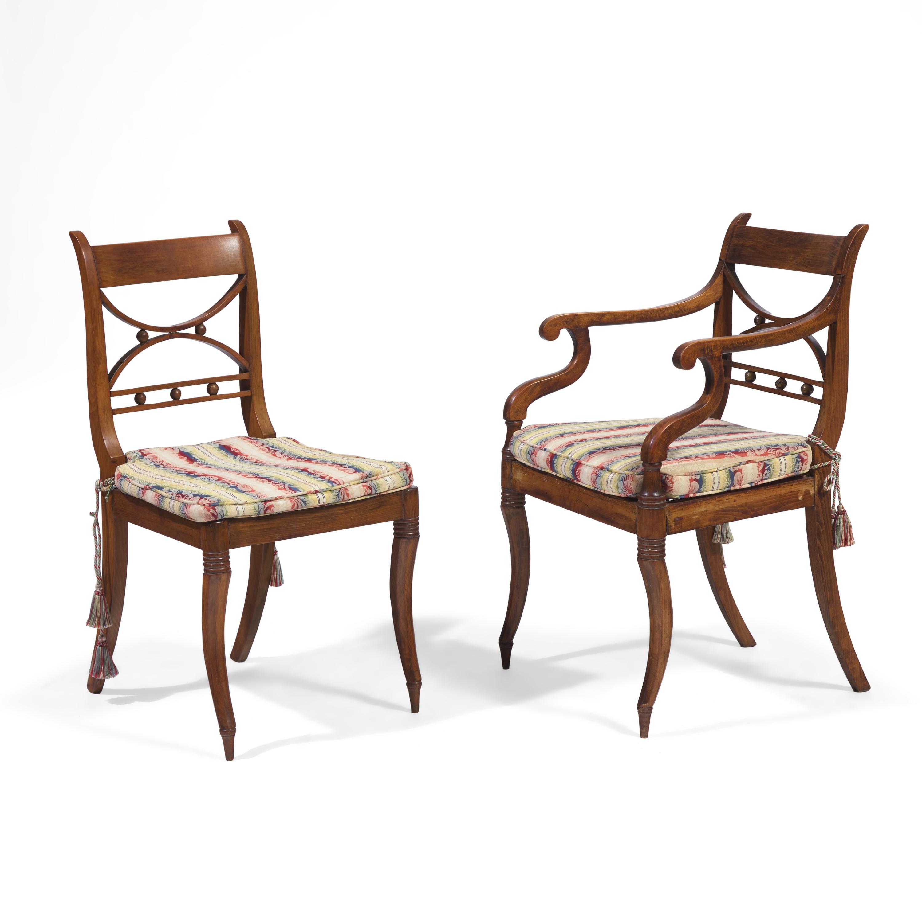 A Set of Twelve Regency Style Fruitwood Dining Chairs
