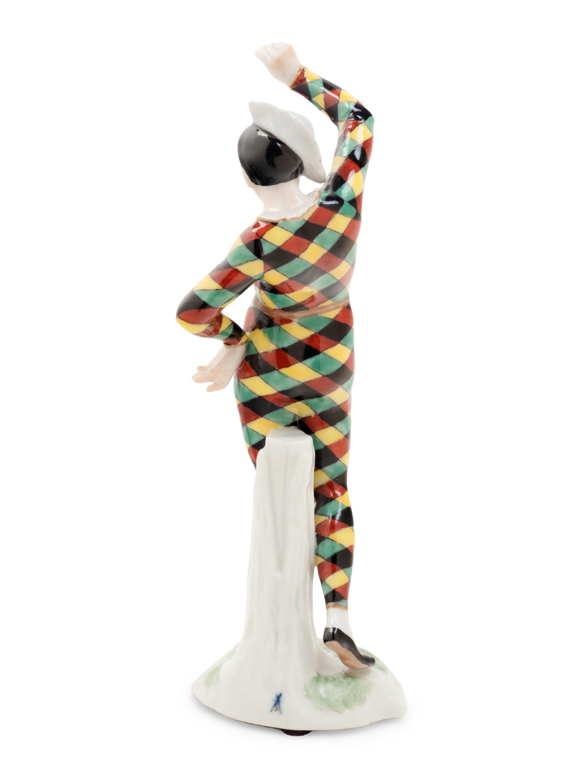 A German Porcelain Harlequin Figure
