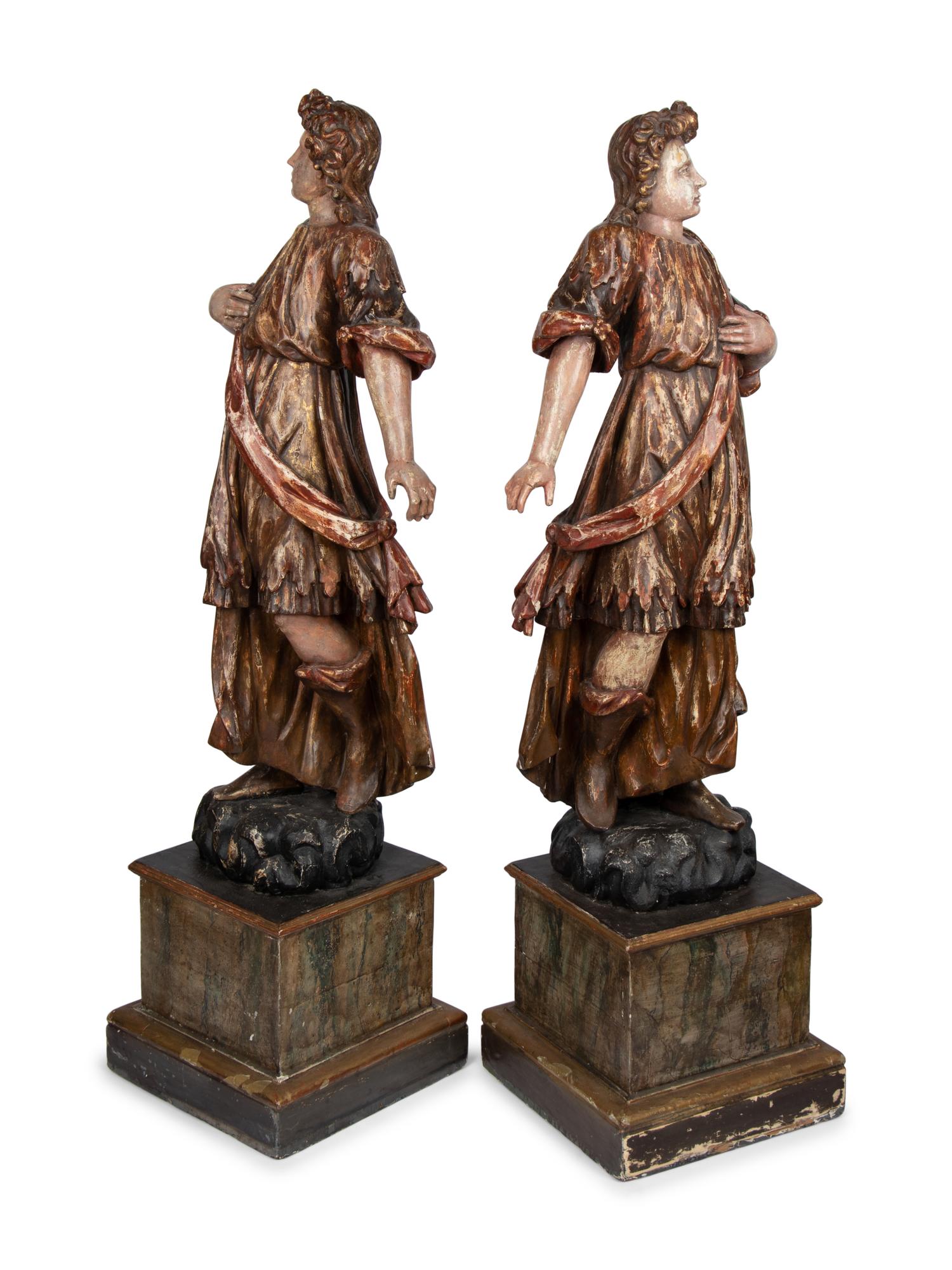A Pair of Italian Painted and Parcel Gilt Figures of Saints