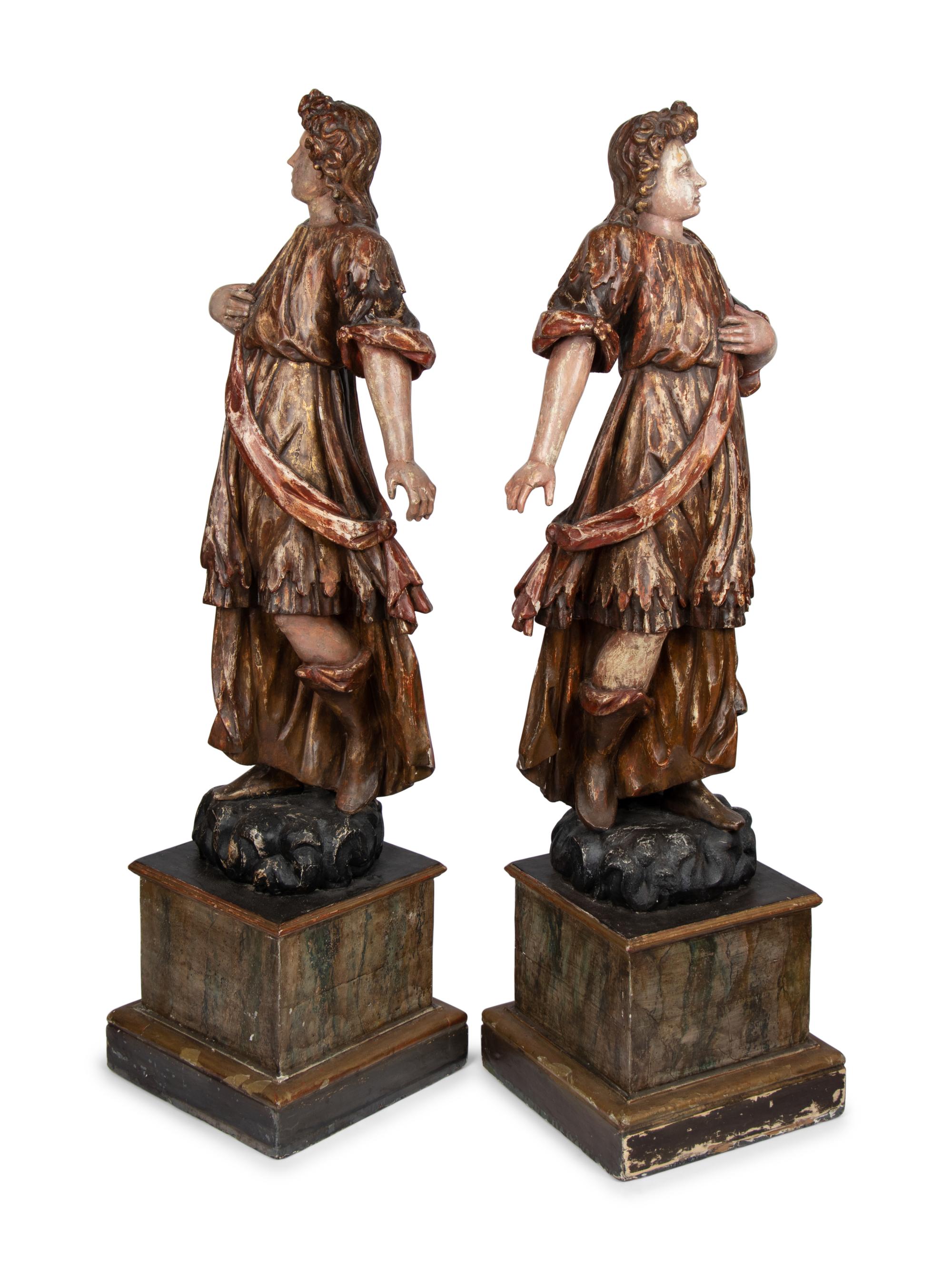 A Pair of Italian Painted and Parcel Gilt Figures of Saints