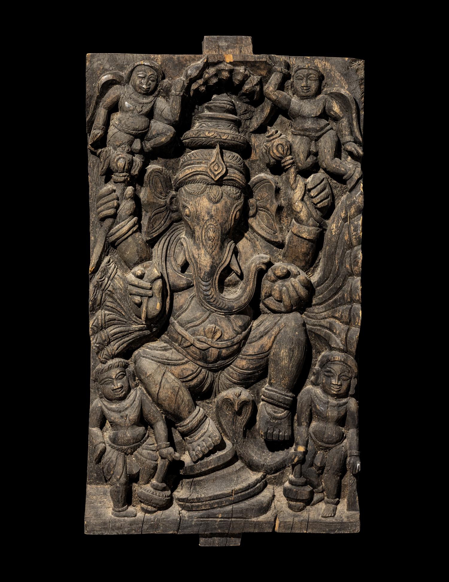 An Indian Carved Wood Panel of A Ganesha