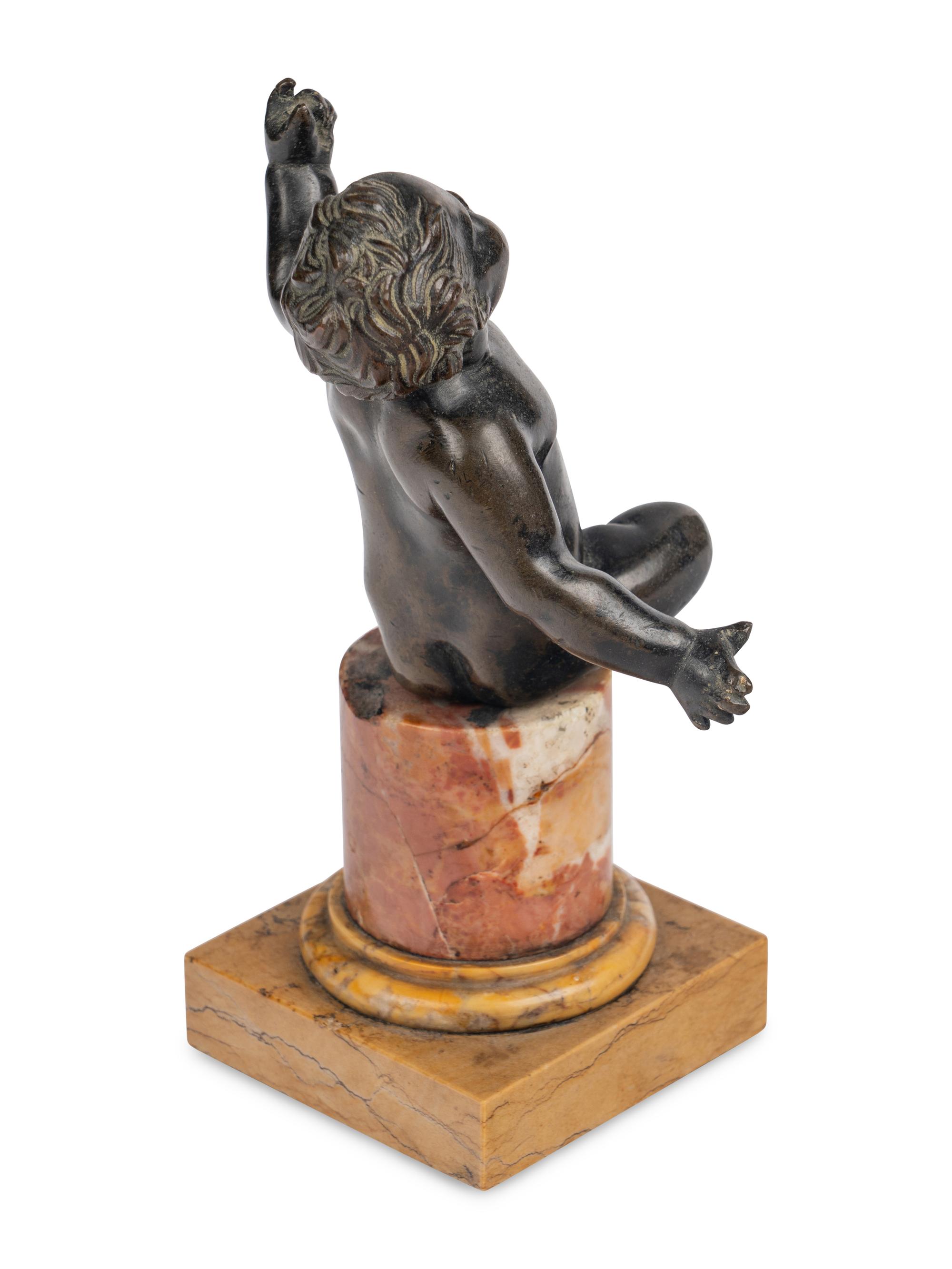 An Italian Bronze Figure of a Putto