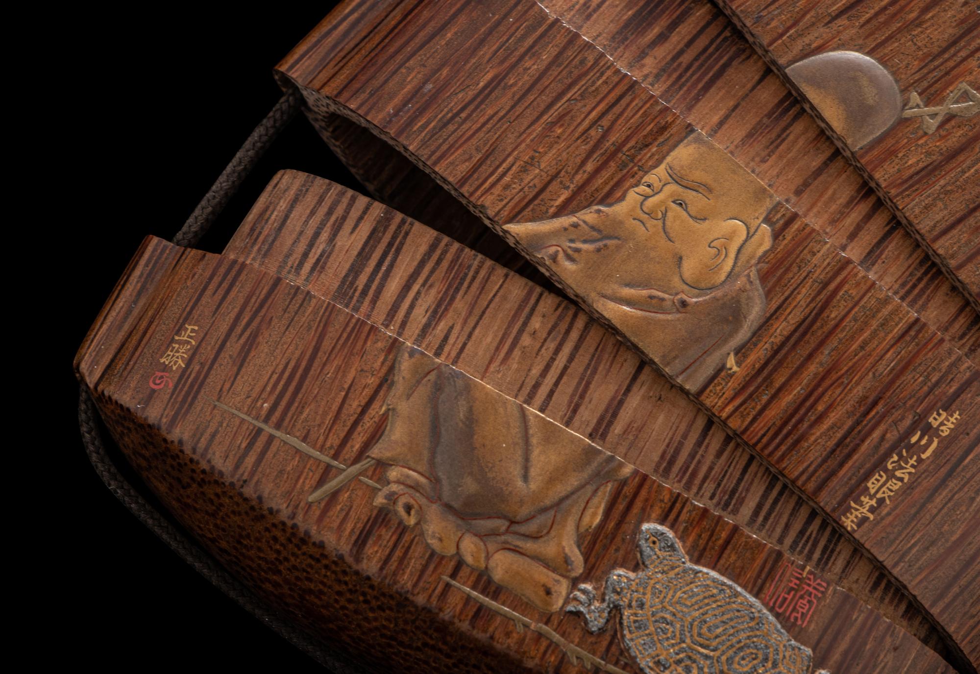A Japanese Gold and Brown Lacquered Wood Two-Case Inro