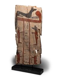 An Egyptian Painted Wood Sarcophagus Panel with Anubis